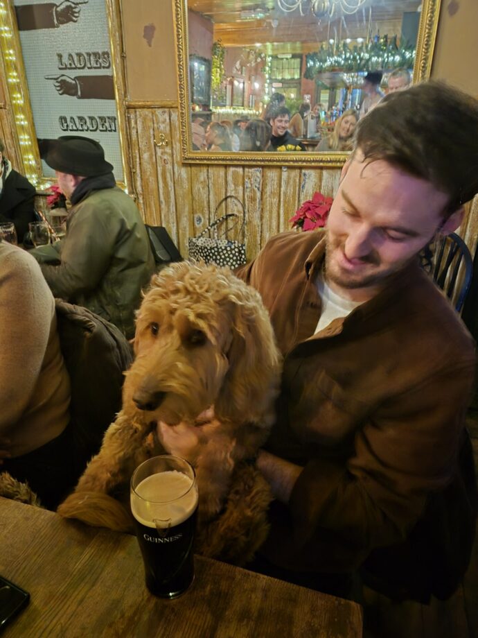 Dog and owner at The Harlequin pub, Clerkenwell, London